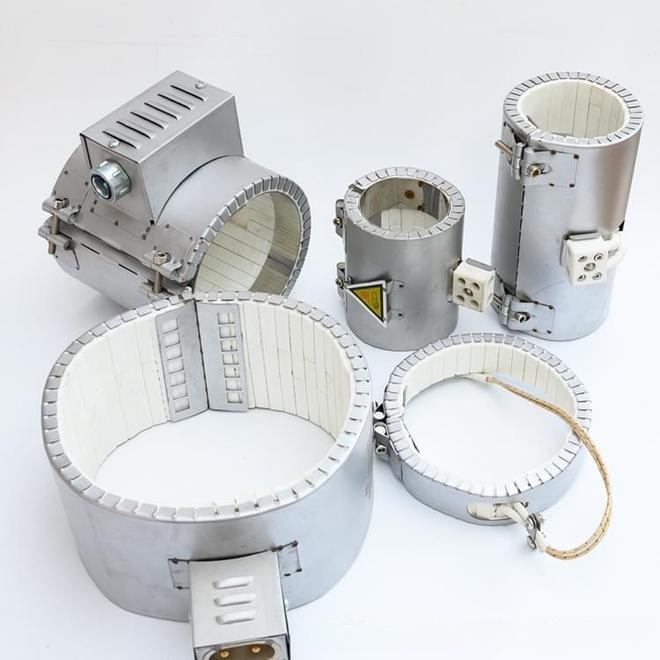 A set of industrial band heaters, including ceramic band heaters and brass band heaters, equipped with cable connections and mounting structures, ideal for injection molding machines and extruders.
