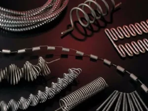 Variety of metallic heating elements with coiled, spiral, and custom designs for industrial heating applications, ensuring high thermal efficiency and durability.