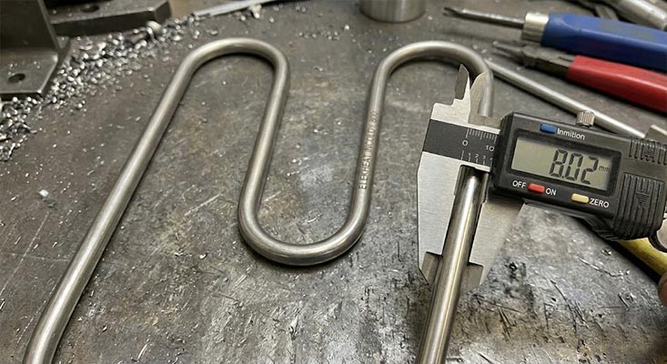 Macro shot of an ELEKHEAT industrial-grade oven heating element made from premium Incoloy, showcasing precision welding and high-quality corrosion-resistant finish for OEM buyers.